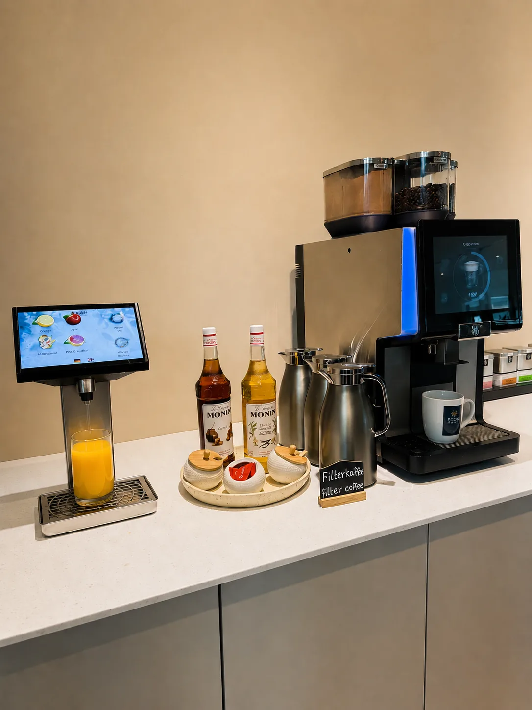 Fuldautomatisk kaffemaskine og friskpresset juice